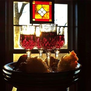 photo of wine glasses and bread board 